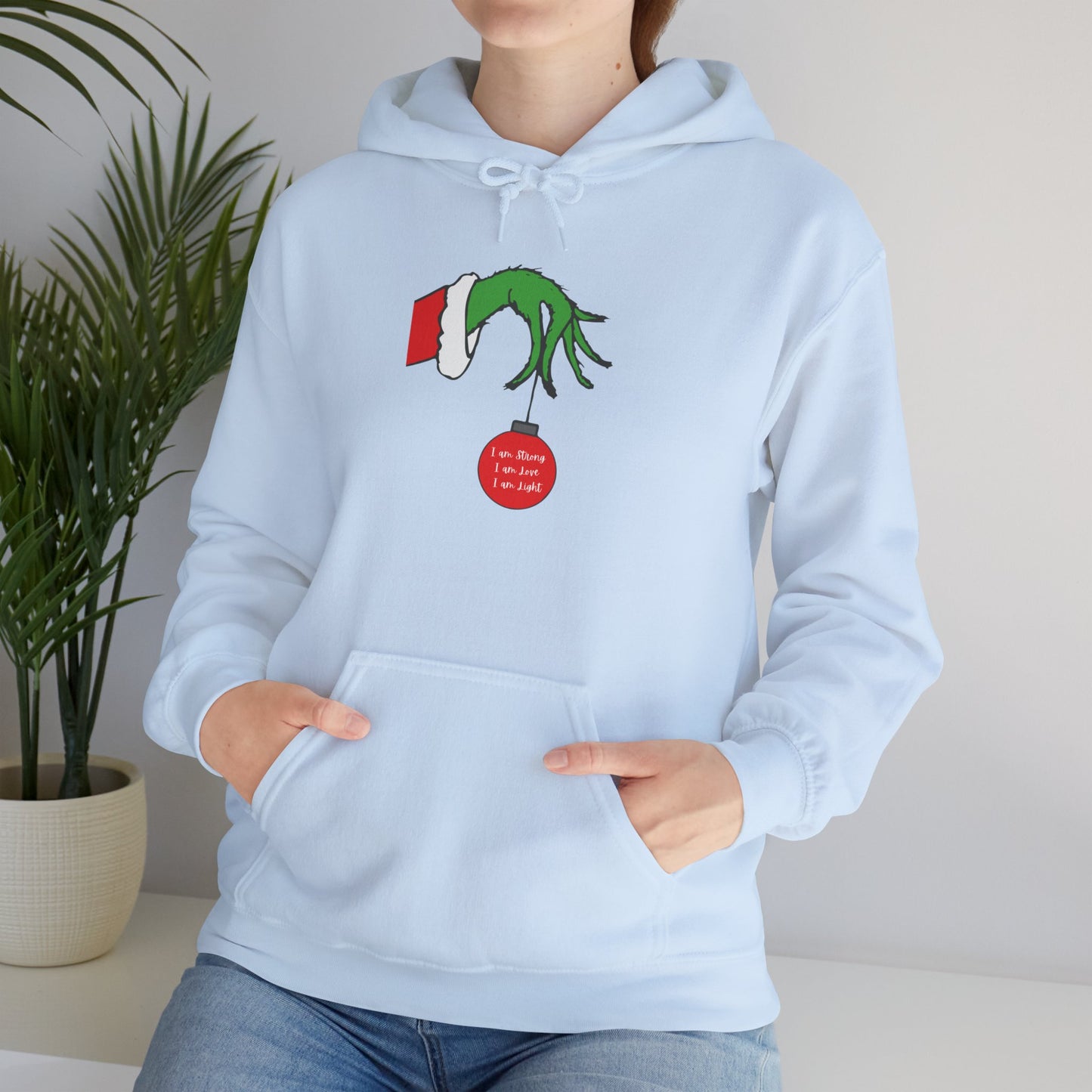 Grinch Hand Holding Ornament Hoodie