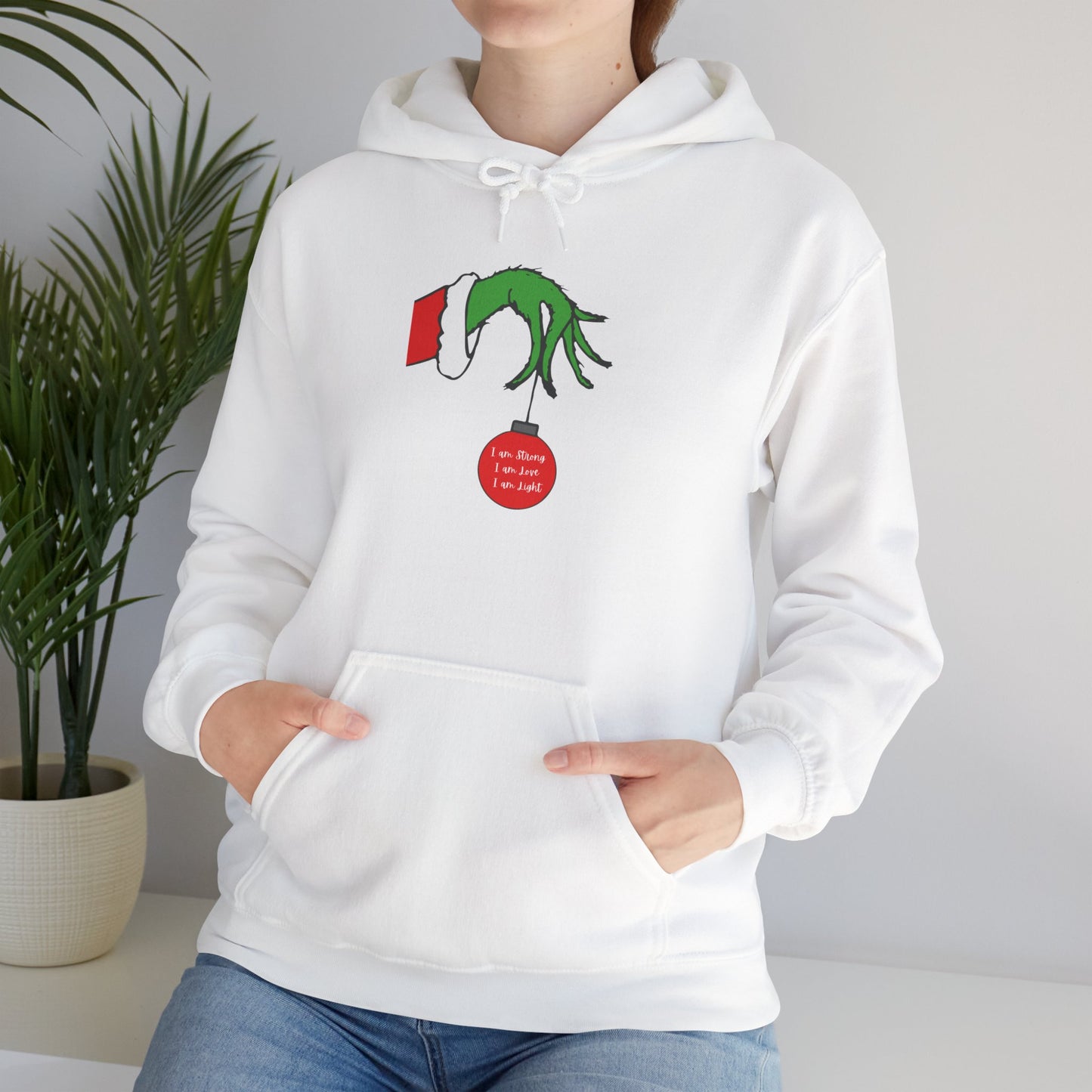 Grinch Hand Holding Ornament Hoodie