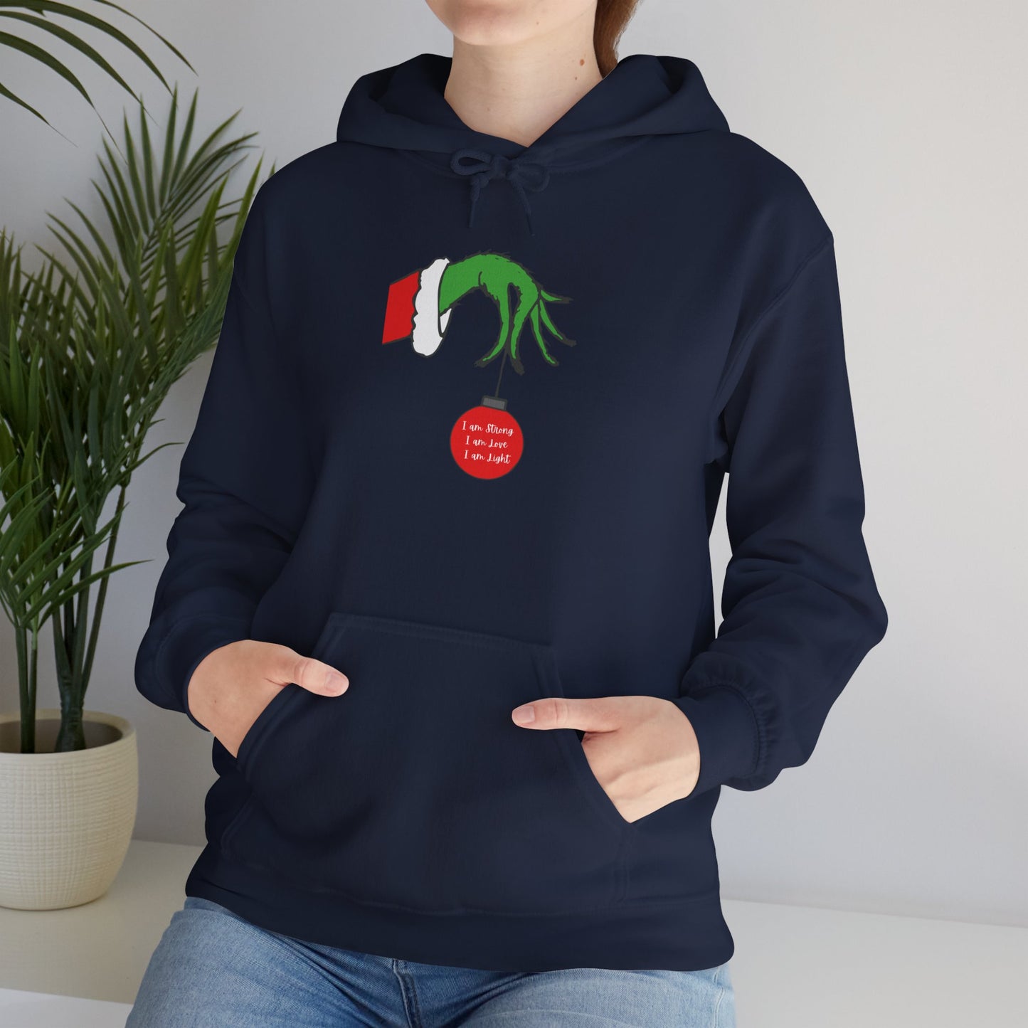 Grinch Hand Holding Ornament Hoodie